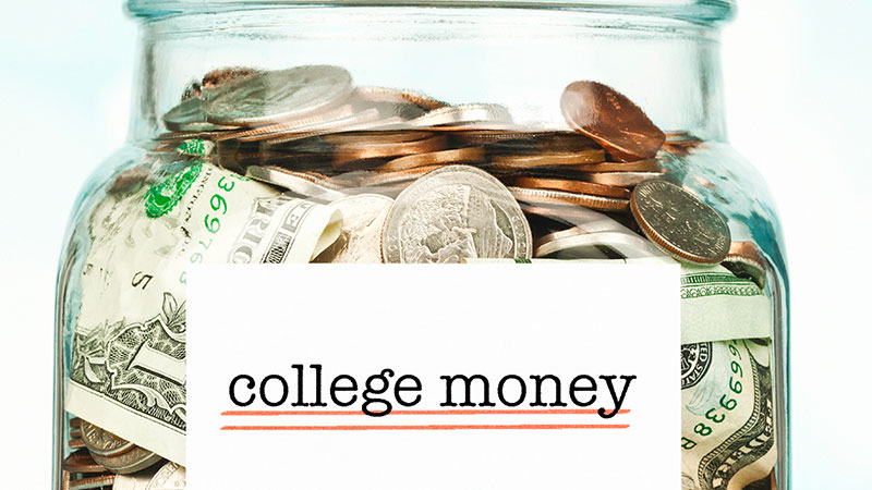 Jar labeled college money filled with money.