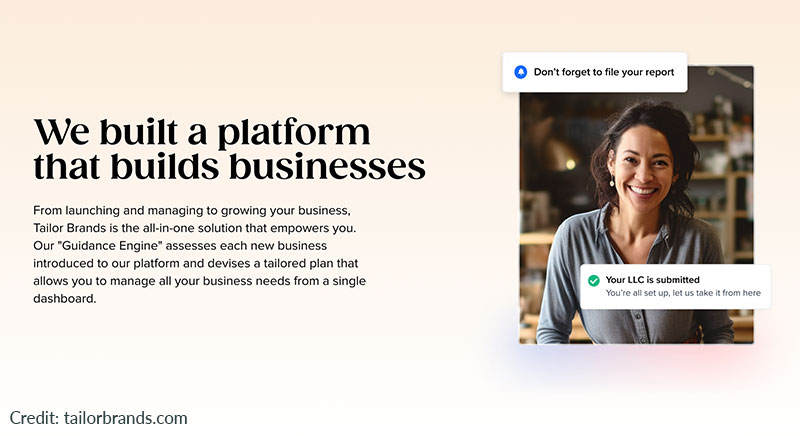 Smiling businessman next to 4 stars and pointing at Tailor Brands logo.
