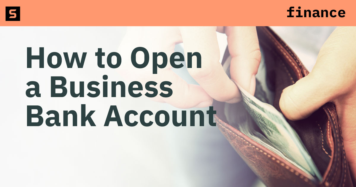 Person with cash getting ready to open a business bank account for their startup.