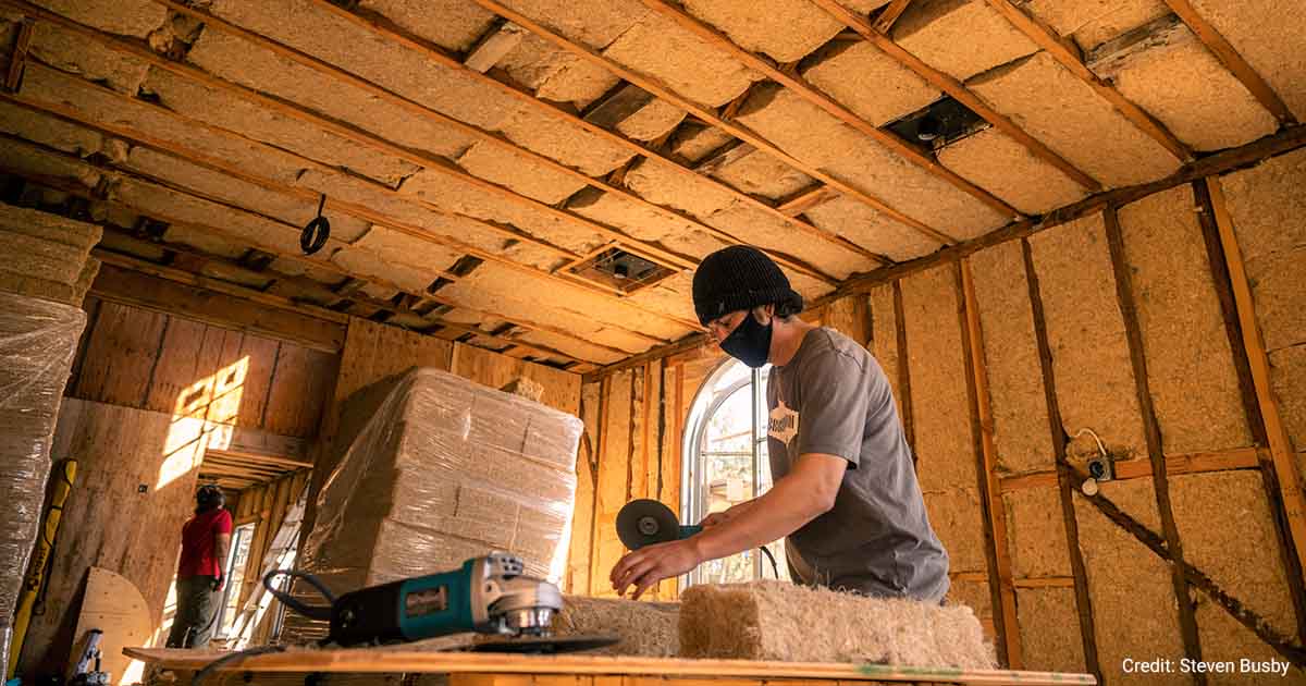 Hempitecture employee working with HempWool.